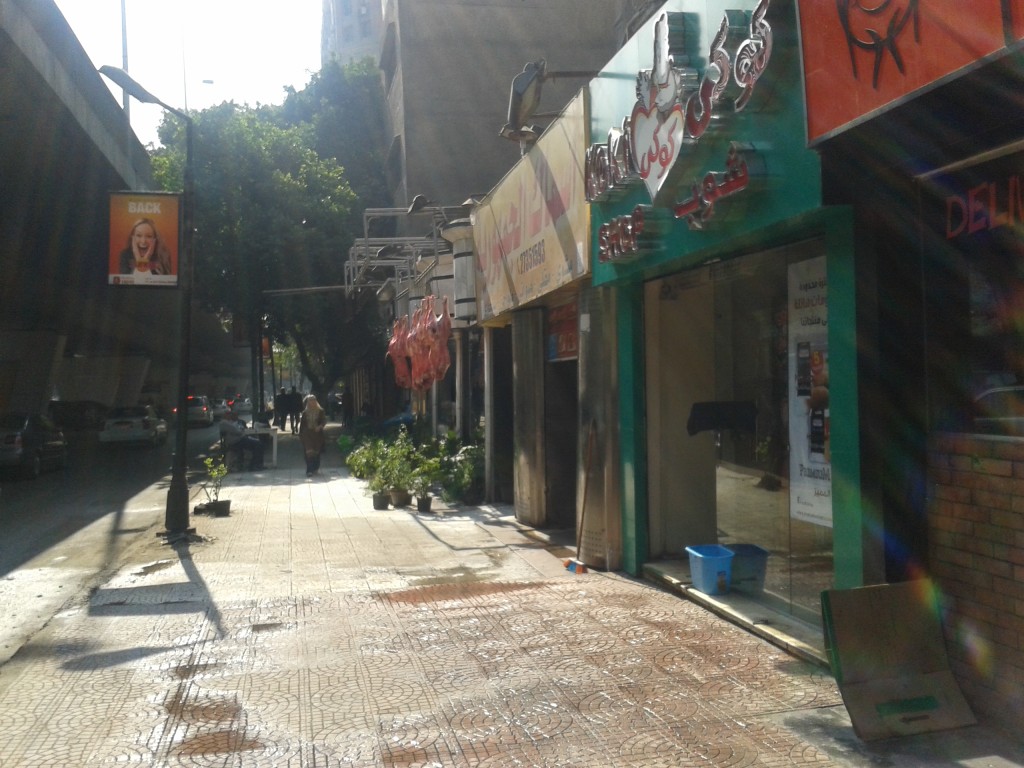 8:50am - Walking to school. I walk a little over a mile from the kids school to mine each day. In the morning the streets are quiet...but you can see the butcher has already hung his meat out to dry