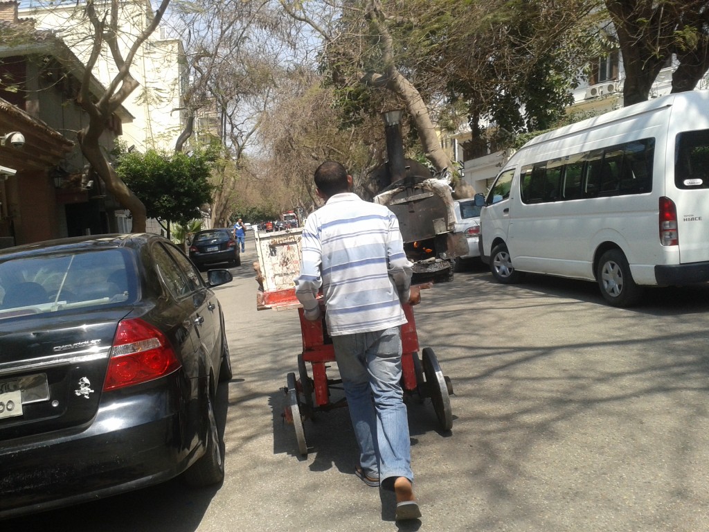 11:15a-this is a common sight. A botatas cart. Can you see the stove on his cart? He cooks up potatoes in his charcoal stove and serves them on the street.