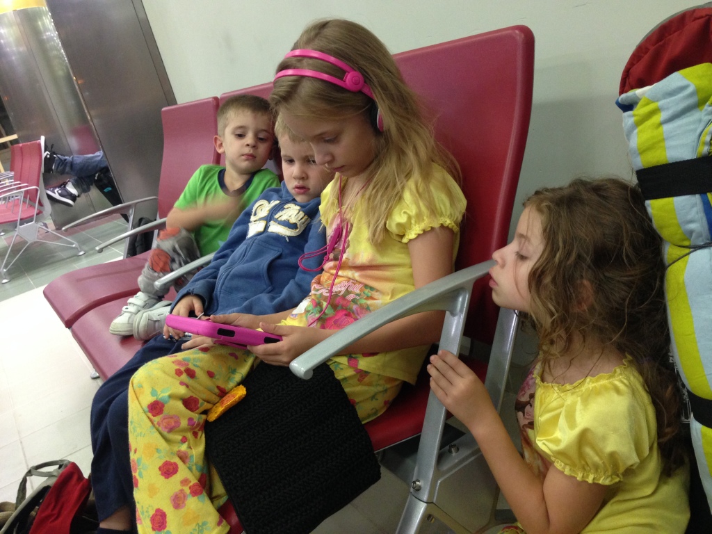 2.22-Waiting for leg one of our 36 hour flight to our passport country...these tired four were so good!